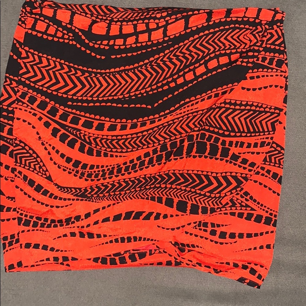 Orange and black wrap Bebe skirt.